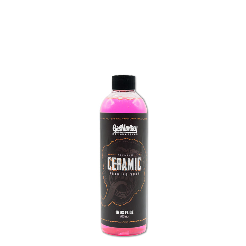 Front view of GMG Premium Ceramic Soap bottle showcasing pink soap and a black label on a white background