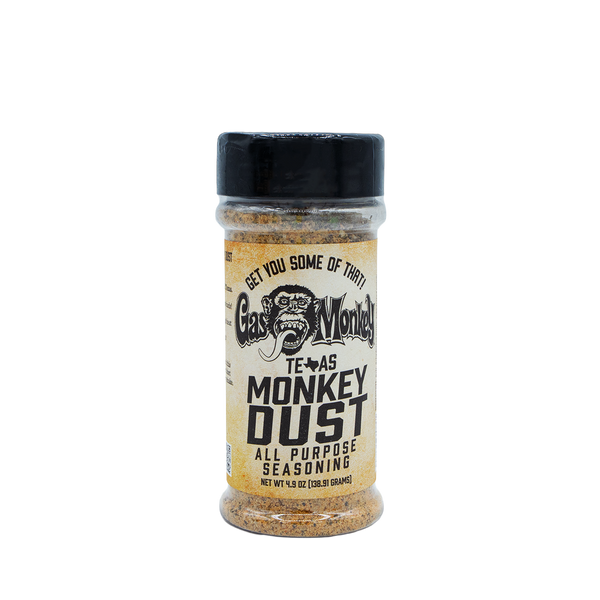 Front view of GMG Monkey Dust Seasoning 4.9oz bottle with Texas Monkey Dust all-purpose seasoning label on black background