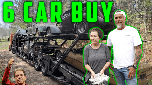 Three adults stand beside a transporter loaded with classic cars on a wooded road beneath the headline 6 CAR BUY