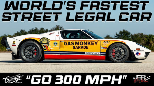 Side view of the BADD GT, a 2006 Ford GT, showcasing Gas Monkey Garage graphics and GO 300 MPH text on a paved track