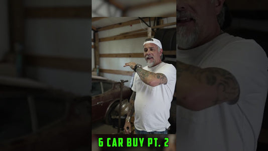 Man in a white shirt points toward a classic car inside a garage, with text reading 6 CAR BUY PT. 2