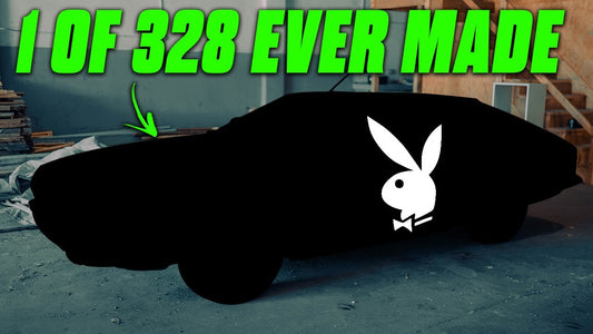 Covered car in a garage, marked 1 of 328 ever made, with a Playboy bunny logo