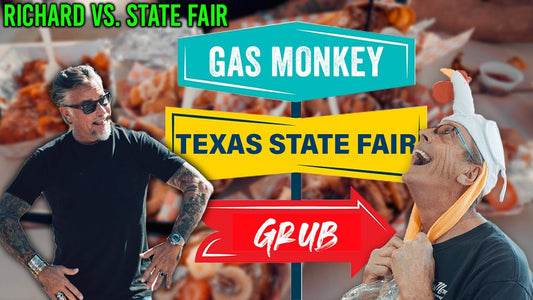 Richard and Phipps pose beside a sign reading Gas Monkey, Texas State Fair, and Grub over fried fair food