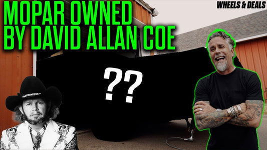 Mopar owned by David Allan Coe with Richard Rawlings beside it outside a barn