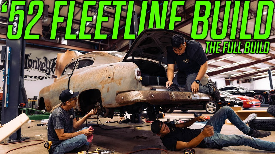 Mechanics work beneath and on a rusty 1952 Fleetline during the full build at Gas Monkey Garage