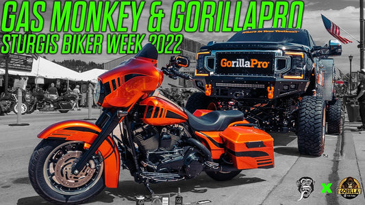 Orange touring motorcycle beside a black GorillaPro truck with Gas Monkey and GorillaPro Sturgis Biker Week 2022 headline