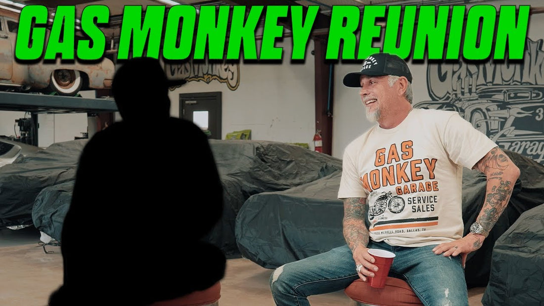 Man seated in a garage beside a silhouetted person during a Gas Monkey reunion