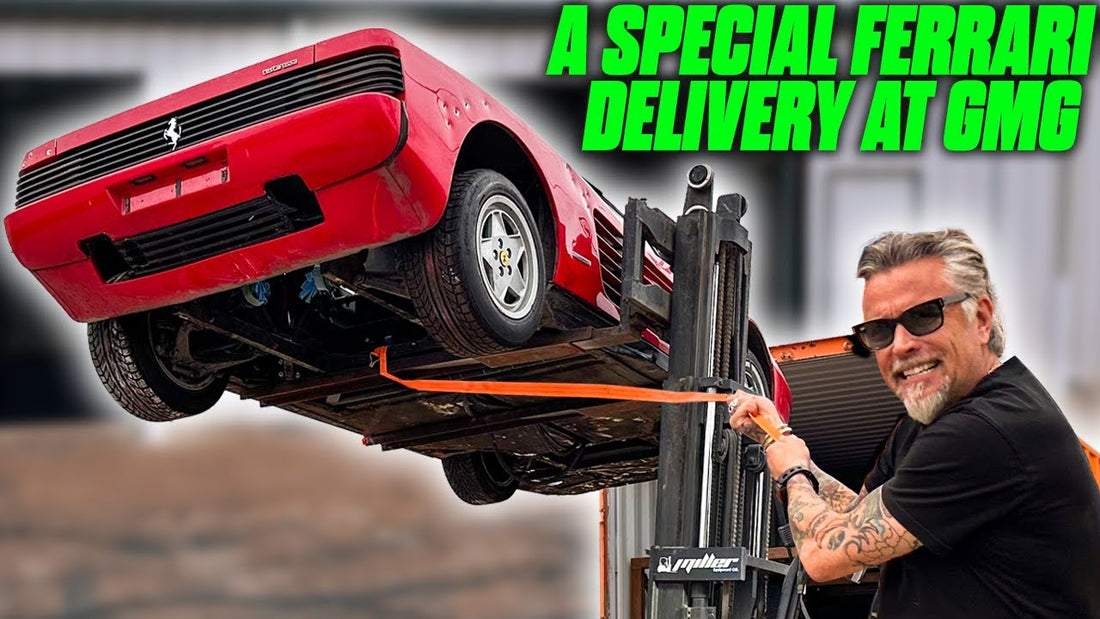 A red Ferrari Testarossa is lifted by forklift as a man guides delivery at Gas Monkey Garage, special Ferrari delivery at GMG