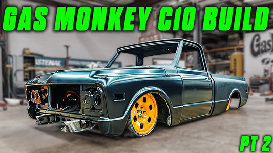 Front three-quarter view of a customized blue 1968 C10 pickup with bright yellow wheels, labeled Gas Monkey C10 Build Pt 2