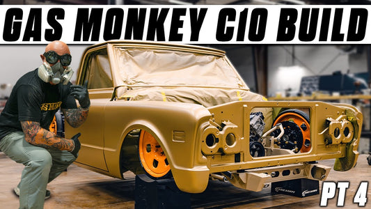 1968 C10 truck in a paint shop with masked windows and orange wheels, labeled Gas Monkey Co Build PT 4