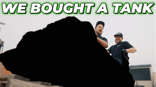 Two men stand behind a tank outdoors under the headline WE BOUGHT A TANK
