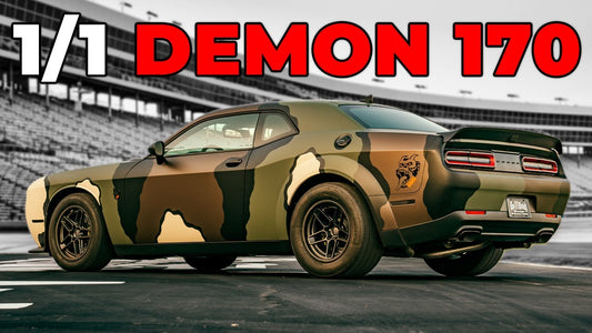 Rear three quarter view of a Dodge Demon 170 with a custom camouflage wrap at a stadium, beneath one of one Demon 170 text