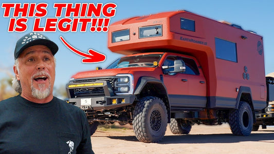 Man standing beside a red EarthRoamer overland truck in a desert setting with This thing is legit headline